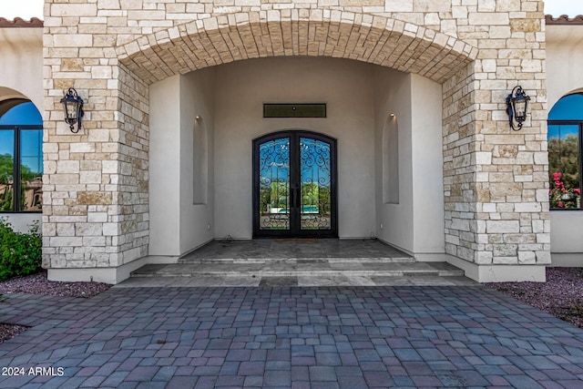 property entrance featuring french doors