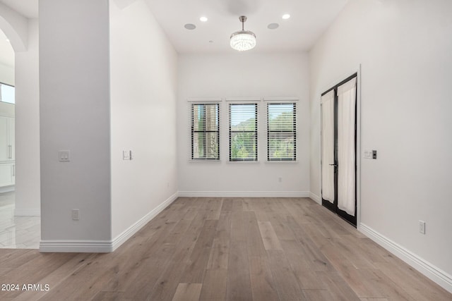 unfurnished room featuring light hardwood / wood-style flooring