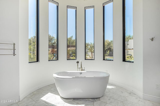 bathroom featuring a tub to relax in