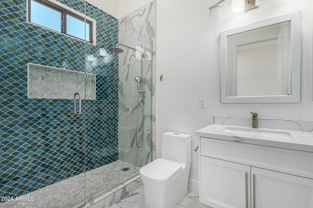 bathroom with vanity, a shower with shower door, and toilet