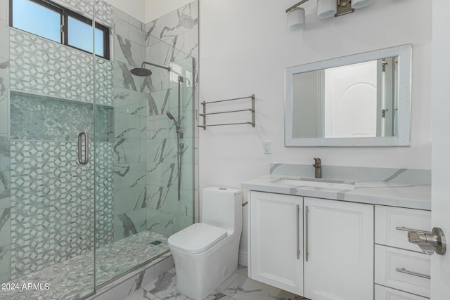 bathroom with a shower with door, vanity, and toilet