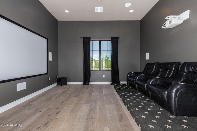 home theater room with light hardwood / wood-style floors