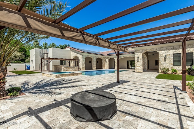 view of swimming pool with a pergola, a patio area, and an in ground hot tub