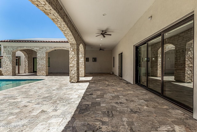 view of patio featuring ceiling fan