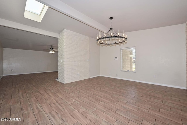 unfurnished room featuring wood finished floors, baseboards, beam ceiling, a skylight, and ceiling fan with notable chandelier