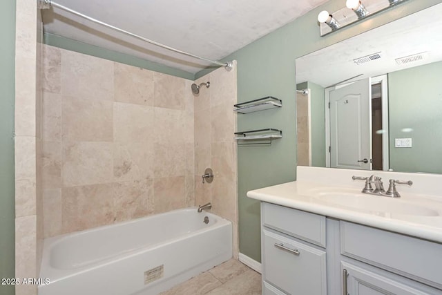 full bathroom featuring visible vents, tub / shower combination, and vanity