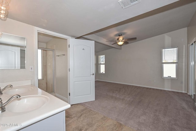 full bathroom with a wealth of natural light, visible vents, a stall shower, and a sink