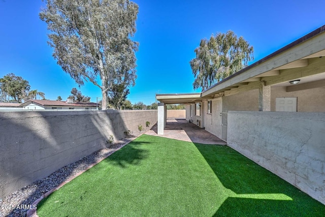 view of yard with a patio and a fenced backyard