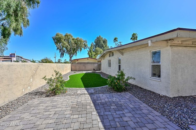 view of yard featuring a fenced backyard and a patio