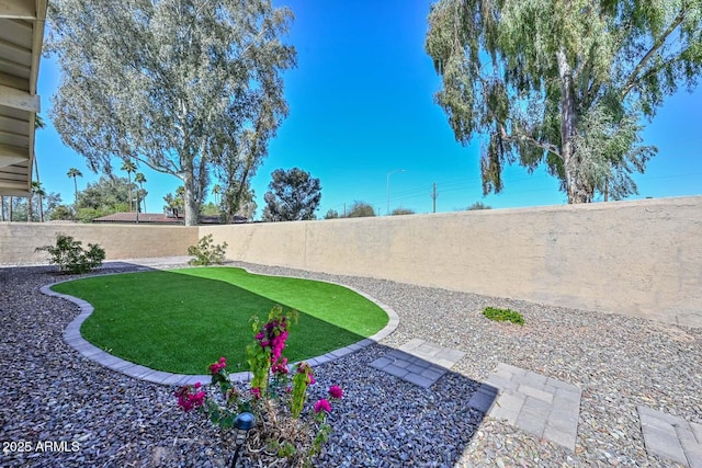 view of yard featuring a fenced backyard