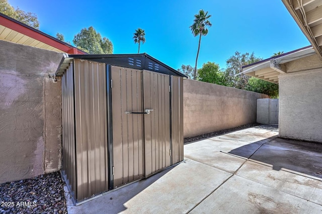 view of shed with a fenced backyard