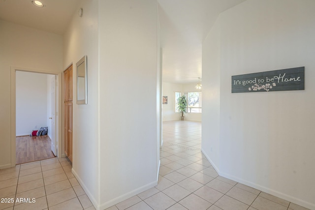 corridor with light tile patterned floors