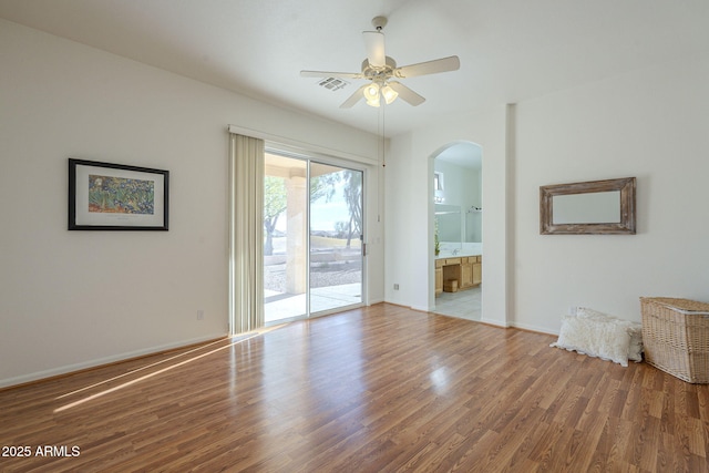 unfurnished room featuring hardwood / wood-style flooring and ceiling fan