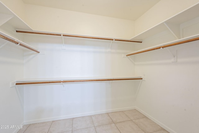 walk in closet featuring light tile patterned floors