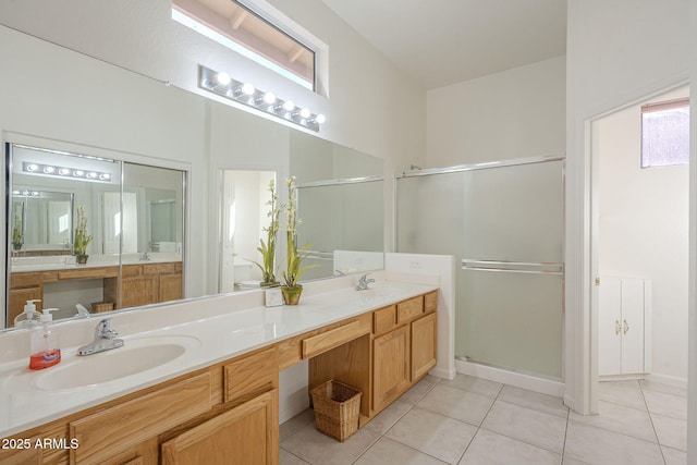 bathroom with vanity, tile patterned floors, and walk in shower