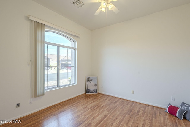 unfurnished room featuring ceiling fan and light hardwood / wood-style flooring