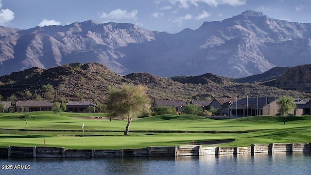 view of property's community with a yard and a water and mountain view