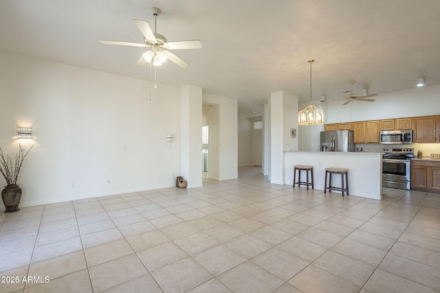 unfurnished living room with light tile patterned flooring and ceiling fan with notable chandelier