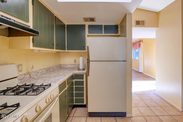 322 N Flynn Jans Ct, Pearce, AZ 85625 - kitchen featuring white appliances, green cabinets, under cabinet range hood, and light countertops