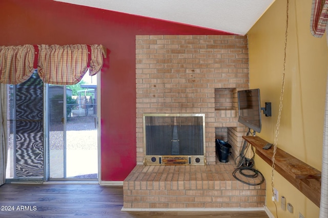322 N Flynn Jans Ct, Pearce, AZ 85625 - living area with wood finished floors, lofted ceiling, and a fireplace