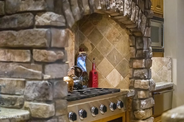 13249 E Summit Dr, Scottsdale, AZ 85259 - kitchen with tasteful backsplash, stainless steel microwave, and brown cabinets