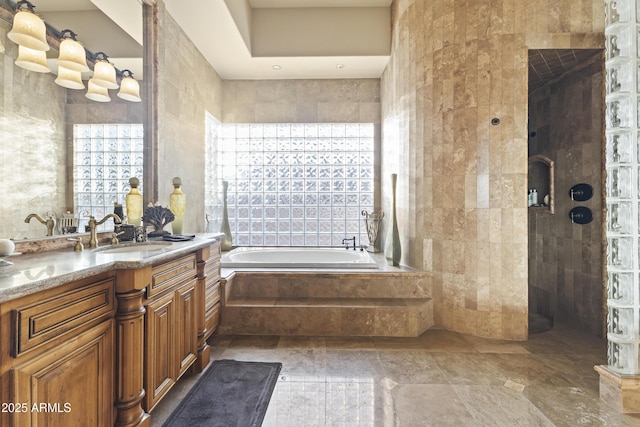 13249 E Summit Dr, Scottsdale, AZ 85259 - full bathroom featuring healthy amount of natural light, a bath, vanity, and tile walls