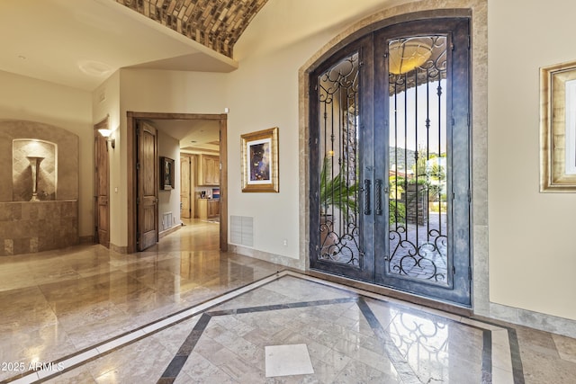 13249 E Summit Dr, Scottsdale, AZ 85259 - foyer featuring inlaid floor details, french doors, and baseboards