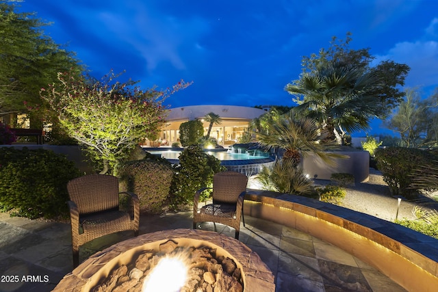 13249 E Summit Dr, Scottsdale, AZ 85259 - view of patio / terrace featuring an outdoor fire pit and an outdoor pool