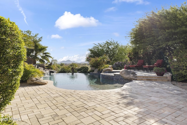 13249 E Summit Dr, Scottsdale, AZ 85259 - outdoor pool featuring a patio and a mountain view
