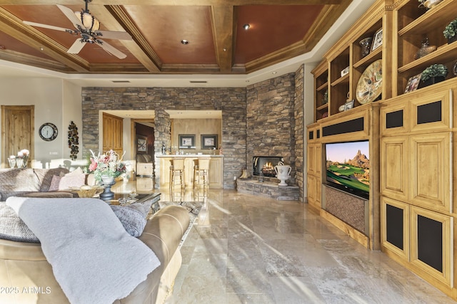 13249 E Summit Dr, Scottsdale, AZ 85259 - living room with a ceiling fan, ornamental molding, a fireplace, light marble finish flooring, and coffered ceiling