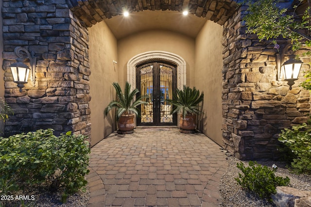 13249 E Summit Dr, Scottsdale, AZ 85259 - doorway to property featuring french doors, stucco siding, and stone siding