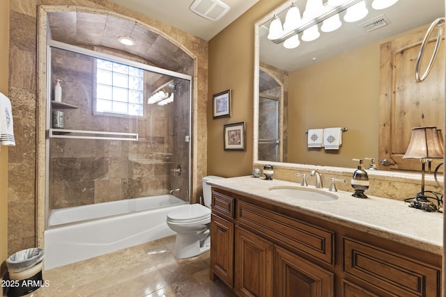 13249 E Summit Dr, Scottsdale, AZ 85259 - bathroom featuring toilet, vanity, and enclosed tub / shower combo
