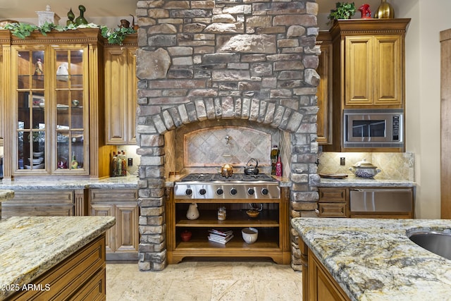 13249 E Summit Dr, Scottsdale, AZ 85259 - kitchen with appliances with stainless steel finishes, light stone countertops, and backsplash