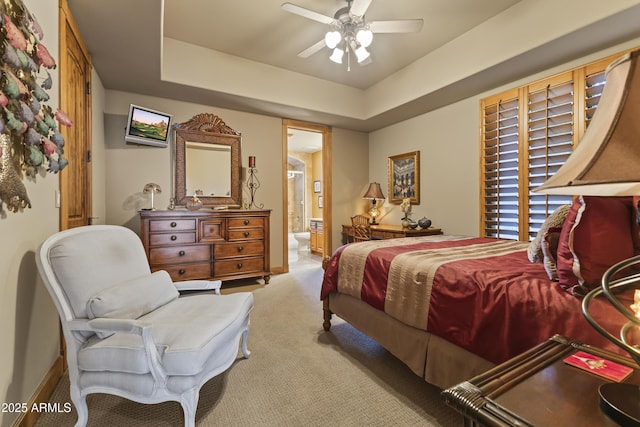 13249 E Summit Dr, Scottsdale, AZ 85259 - bedroom featuring carpet floors, a tray ceiling, ensuite bathroom, a ceiling fan, and baseboards