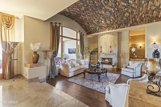 13249 E Summit Dr, Scottsdale, AZ 85259 - living area with a large fireplace, vaulted ceiling, and baseboards