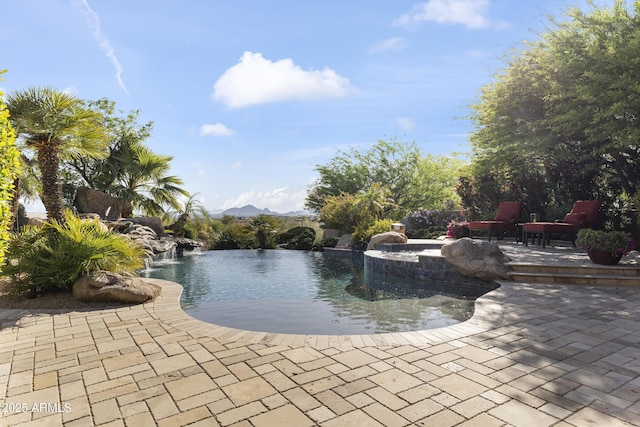 13249 E Summit Dr, Scottsdale, AZ 85259 - outdoor pool featuring a patio and a mountain view
