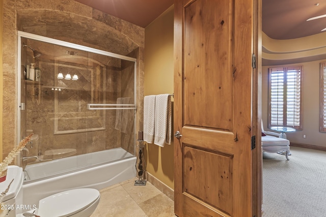 13249 E Summit Dr, Scottsdale, AZ 85259 - bathroom with baseboards, shower / bath combination with glass door, toilet, and a ceiling fan