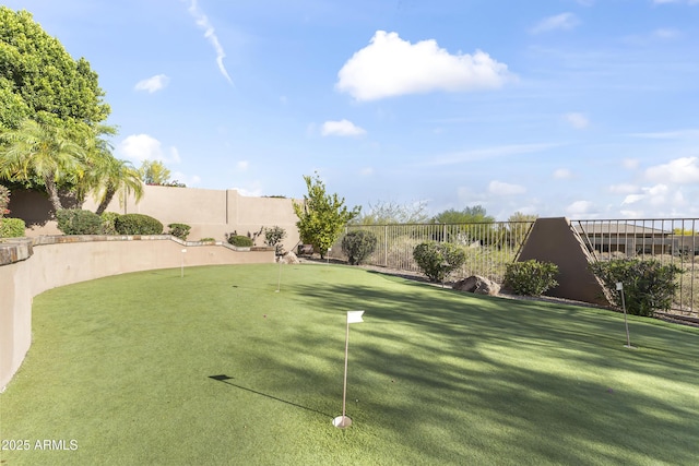 13249 E Summit Dr, Scottsdale, AZ 85259 - view of yard featuring a putting green and fence