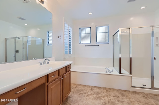 8766 W Hayward Ave, Glendale, AZ 85305 - full bathroom with vanity, a stall shower, a bath, and recessed lighting