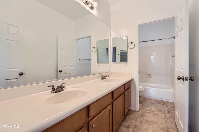 8766 W Hayward Ave, Glendale, AZ 85305 - bathroom featuring toilet, double vanity, and shower / bath combination