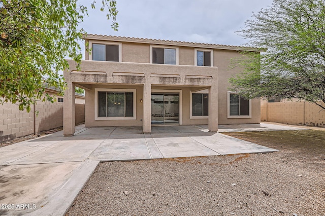 8766 W Hayward Ave, Glendale, AZ 85305 - back of property with stucco siding, a fenced backyard, a patio, and a tiled roof