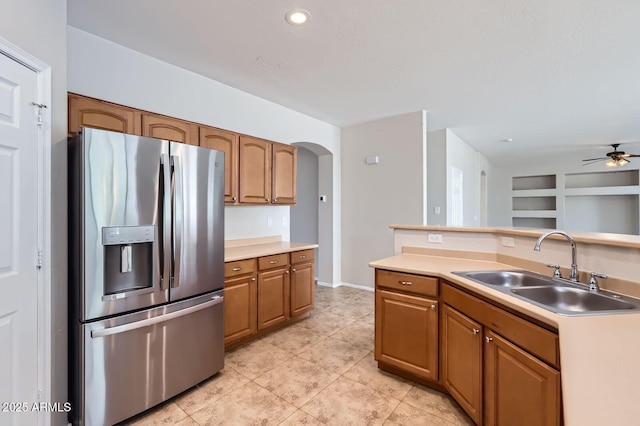 8766 W Hayward Ave, Glendale, AZ 85305 - kitchen featuring stainless steel fridge, a sink, ceiling fan, light countertops, and light tile patterned floors