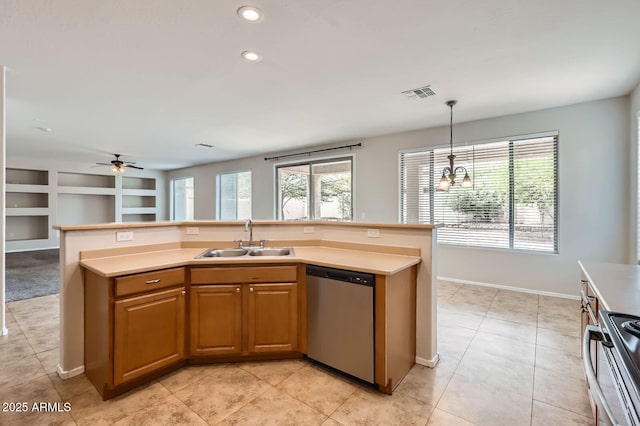 8766 W Hayward Ave, Glendale, AZ 85305 - kitchen with stainless steel appliances, a sink, healthy amount of natural light, a ceiling fan, and recessed lighting