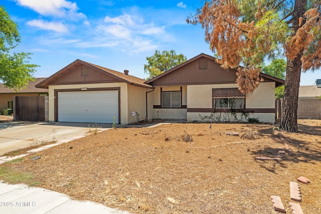 6015 W Acoma Dr, Glendale, AZ 85306 - ranch-style house featuring a garage, driveway, and stucco siding