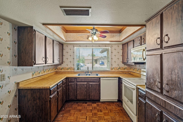 6015 W Acoma Dr, Glendale, AZ 85306 - kitchen featuring white appliances, wallpapered walls, dark brown cabinets, a textured ceiling, and a ceiling fan