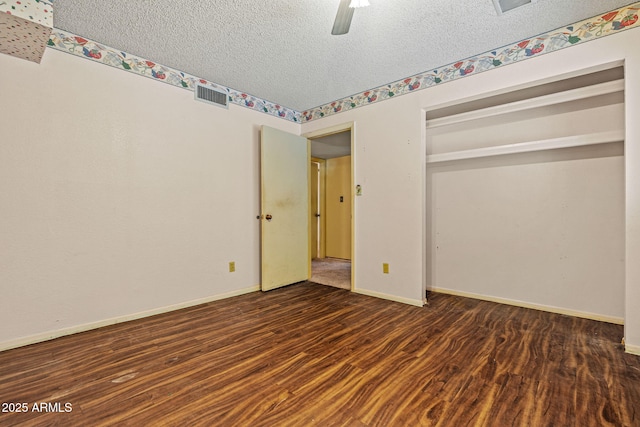 6015 W Acoma Dr, Glendale, AZ 85306 - unfurnished bedroom featuring a textured ceiling, wood finished floors, a ceiling fan, and a closet