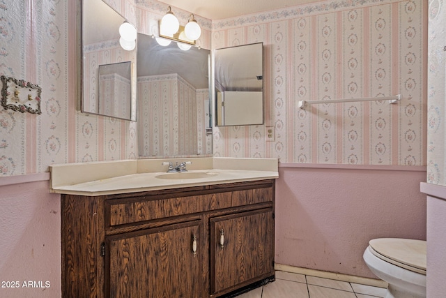 6015 W Acoma Dr, Glendale, AZ 85306 - bathroom featuring vanity, tile patterned flooring, and wallpapered walls