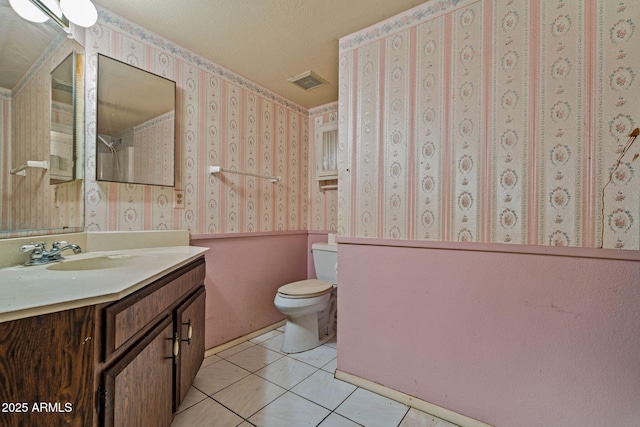 6015 W Acoma Dr, Glendale, AZ 85306 - bathroom with wallpapered walls, vanity, tile patterned floors, and a textured ceiling