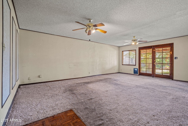 6015 W Acoma Dr, Glendale, AZ 85306 - carpeted empty room with a ceiling fan, a textured ceiling, and french doors