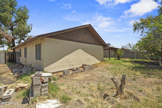 6015 W Acoma Dr, Glendale, AZ 85306 - view of side of property with stucco siding and board and batten siding